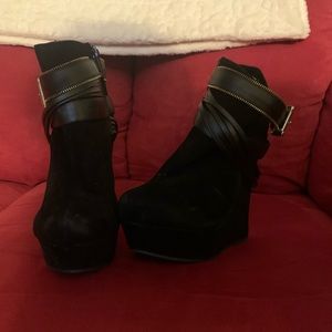 Black suede wedge, with a gold zipper trim.